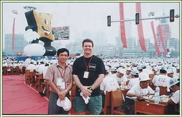 Mick Reiss at the 2001 Guiyang Go Festival, China. There are 4,000 people behind him, all playing Go!