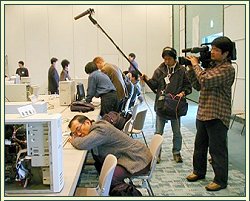 The author of Amano Shogi catches up on some sleep at the 1999 World Computer Shogi Championship in Tokyo